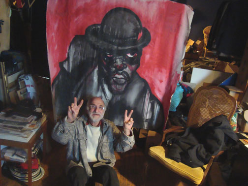 Peter Dunn with a painting by Anthony Stagg
