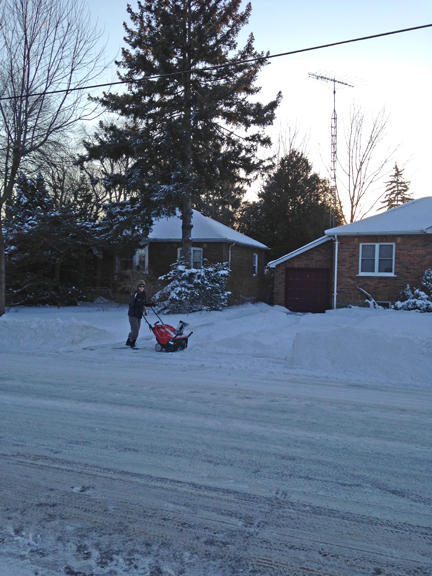 Our neighbour digging out after work